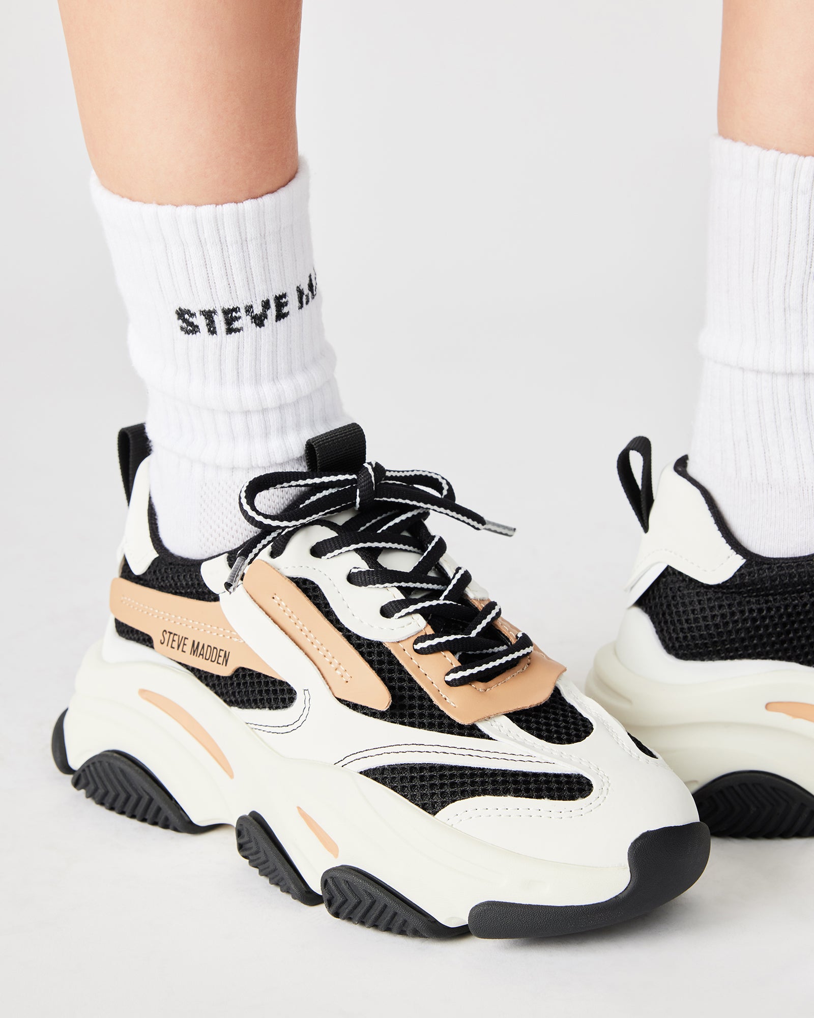 STEVEMADDEN_SHOES_POSSESSION_BLACK-TAN_LIFESTYLE_01.jpg